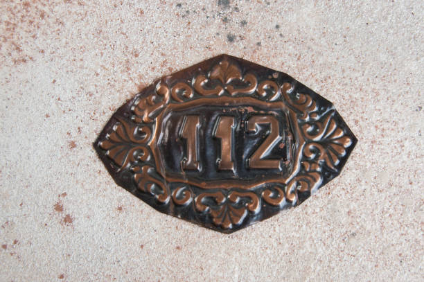istock Old copper home number sign 1039199456