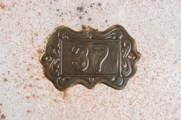 Old brass home number sign