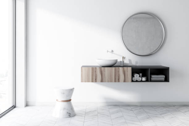 istock White bathroom with a round sink, mirror 1039202304
