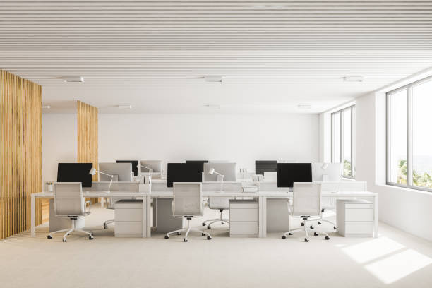 istock White and wooden open plan office interior 1039202348