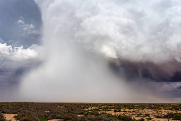 Microburst with hail and heavy rain falling from a thunderstorm. Dramatic microburst with hail and heavy rain falling from a severe thunderstorm over northern Arizona. Microburst stock pictures, royalty-free photos & images