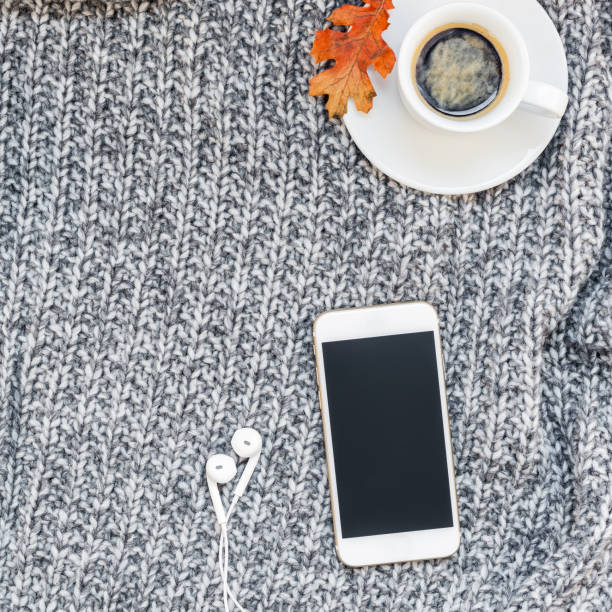 istock Home workplace with coffee cup on knitted plaid 1039203266