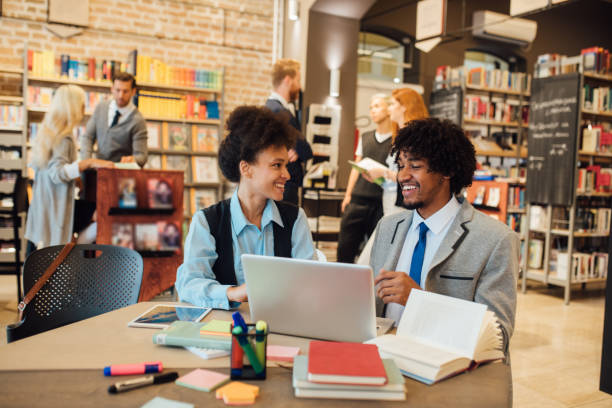 istock Smiling young couple with laptop 1039204278