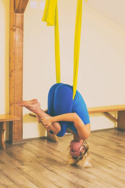 istock Woman doing aerial yoga 1039209842