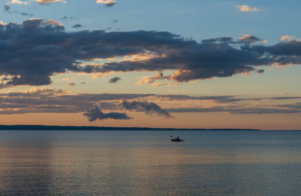 istock Kayaker Paddling in the Twilight 1039215250