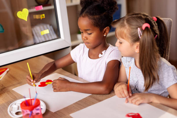 istock Schoolgirls doing an art project 1039221470