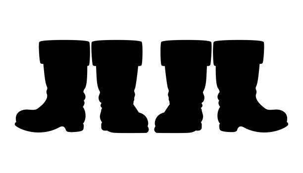 weihnachtsmann oder nikolaus stiefel - schwarze silhouette von zwei paaren - nikolaus stiefel stock-grafiken, -clipart, -cartoons und -symbole
