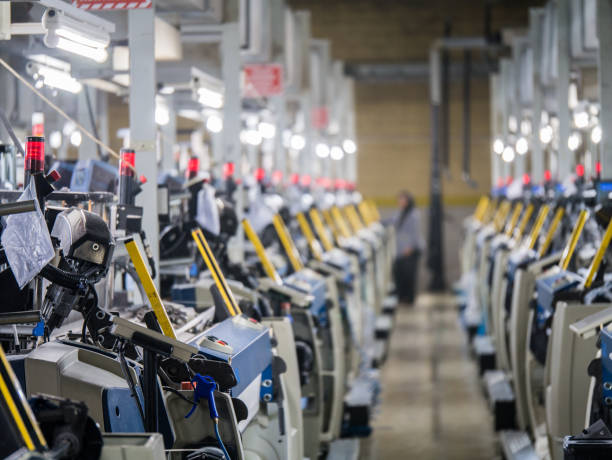 istock Weaving loom machines in textile factory 1039225092