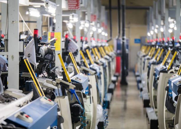 istock Weaving loom machines in textile factory 1039225130