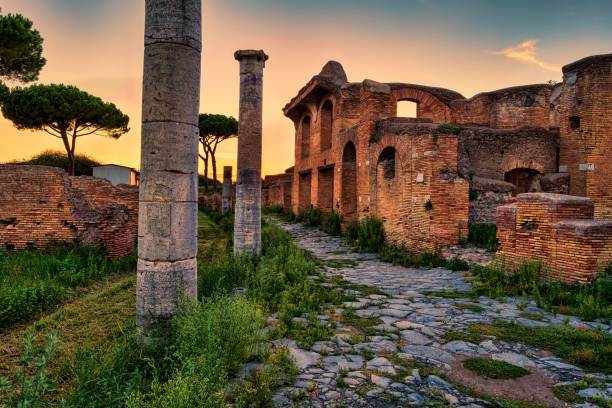 roman empire sunset street view in archeological excavations of ancient ostia - rome - roman ancient rome empire ancient imagens e fotografias de stock