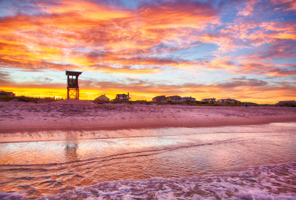 July 9, 2018, Wrightsville Beach, NC, Beach goers enjoy the evening on the beach on the south end of Wrightsville Beach.
