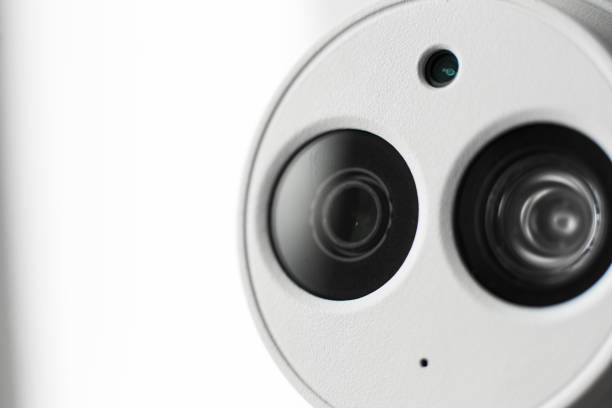 istock White security cctv dome type camera close-up. Lens and ir 1039240210