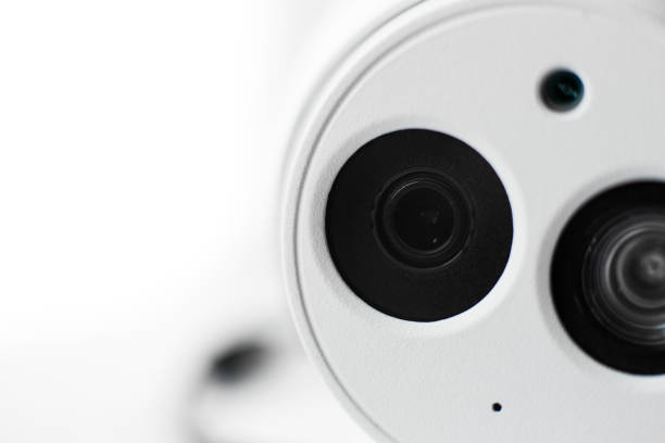 istock White security cctv dome type camera close-up. Lens and ir 1039240378