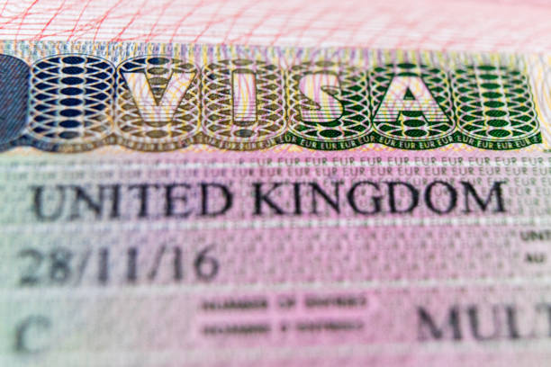 istock Visa stamp travel passport immigration macro emigration 1039240418