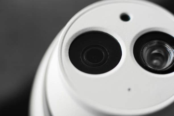 istock White security cctv dome type camera close-up. Lens and ir 1039240448