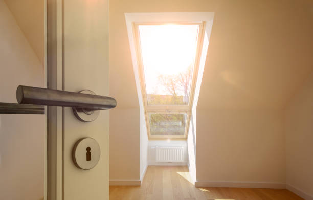 Entrance door to an apartment in the roof top floor in a residential building Entrance door to an apartment in the roof top floor in a residential building dormer stock pictures, royalty-free photos & images