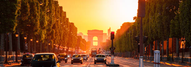 istock Sunset view on Arc de Triomphe (Triumphal Arch) in Chaps Elysees in Paris, France. 1039255318