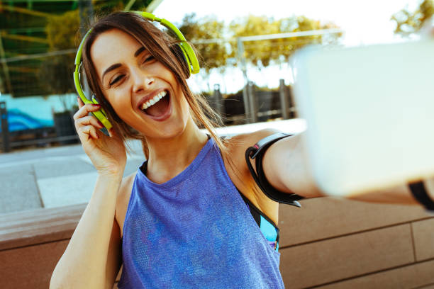 istock Attractive woman taking a selfie after jogging exercise 1039256282