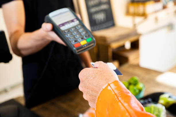 istock A customer about to use a credit or debit card in a retail store 1039261772