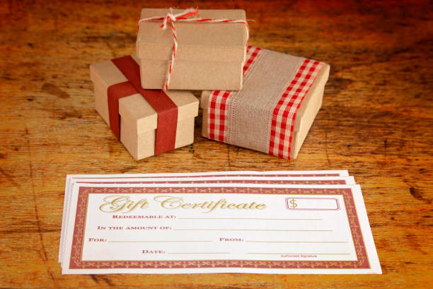 istock Blank Gift Voucher on a Wooden Table 1039267280