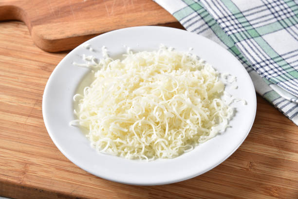Shredded mozzarella cheese Small dish of grated mozzarella cheese shredded mozzarella stock pictures, royalty-free photos & images