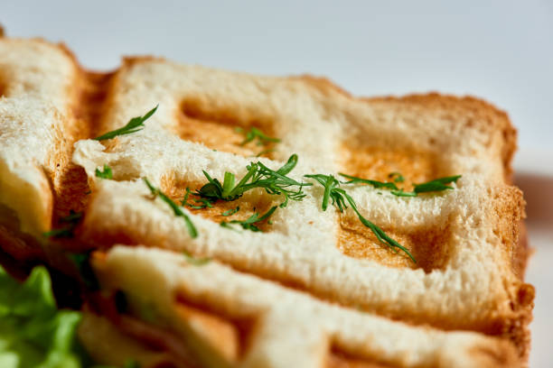 Waffle sandwich with ham and salad./Crispy sandwich with ham and salad. Breakfast.