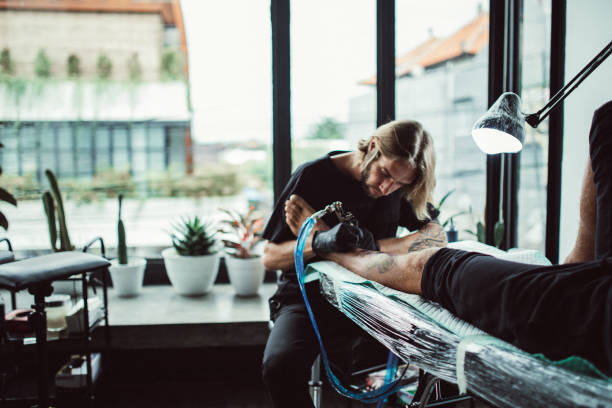 Artist making tattoo