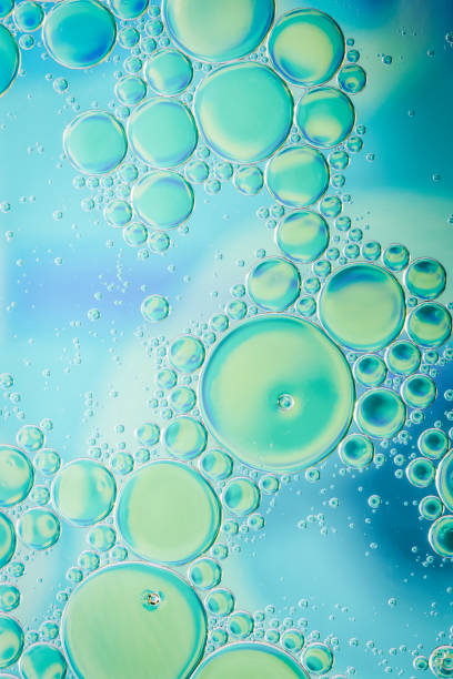 istock Large and small bubbles on blue, green and turquoise background 1039311324