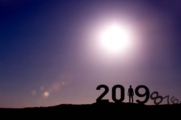 istock Man enjoying on the hill and 2019 years while celebrating new year 1039314760