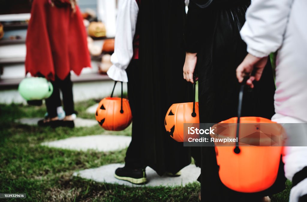 Little children in Halloween costumes Trick Or Treat Stock Photo