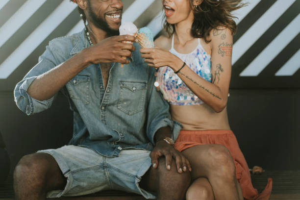 istock Cheerful couple enjoying ice cream 1039332804