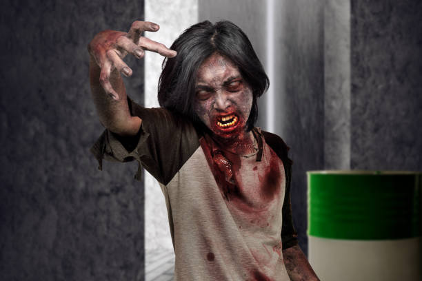 istock Scary zombie man with hands for clawing on the dark place 1039357888