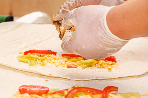 istock Cook breaks the filling into a thin wheat or corn cake 1039361134