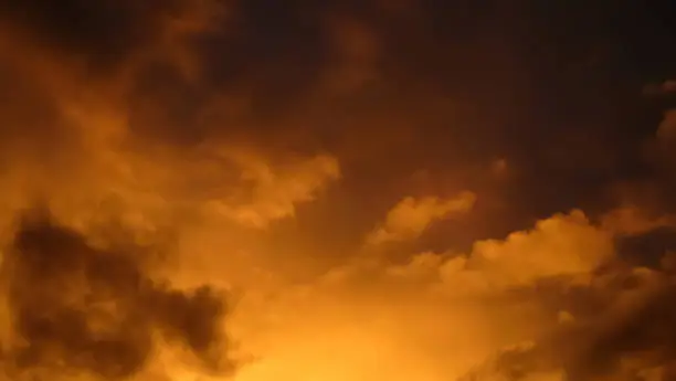 Dramatic sunlit clouds at sunset during a storm