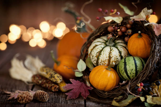 istock Autumn Thanksgiving cornucopia on a rustic wood background 1039384050