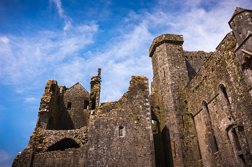The Rock of Cashel is one of Ireland's most spectacular historic sites. A prominent green hill, with limestone outcrops, rises from a grassy plain. On the hill, walls surround a round tower, a13th-century Gothic cathedral and the finest 12th-century Romanesque chapel in Ireland.