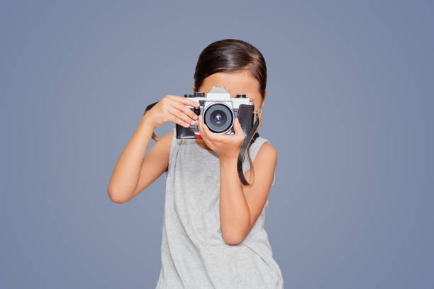 Beautiful girl holding a camera