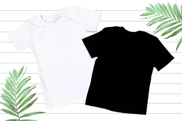 Black & White Unisex Tshirt Mockup - Flat Lay on White Wooden Background