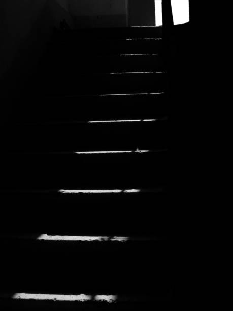 istock dark stairway in ray of the light 1039422456