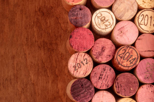 istock Wine corks background, overhead photo of red and white wine corks with copy space 1039422490