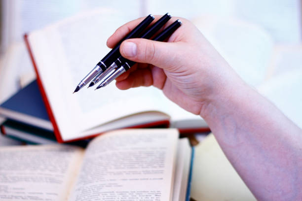 istock Three old pen pens for writing in hand. 1039433892