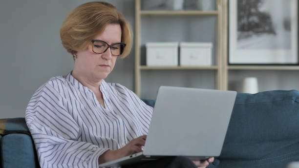 istock Old Woman Working On Laptop 1039462212