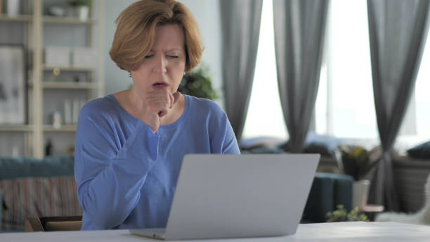 sick old woman coughing at work, cough - 16637 imagens e fotografias de stock