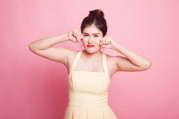 istock Young Asian woman sad and cry. 1039465924
