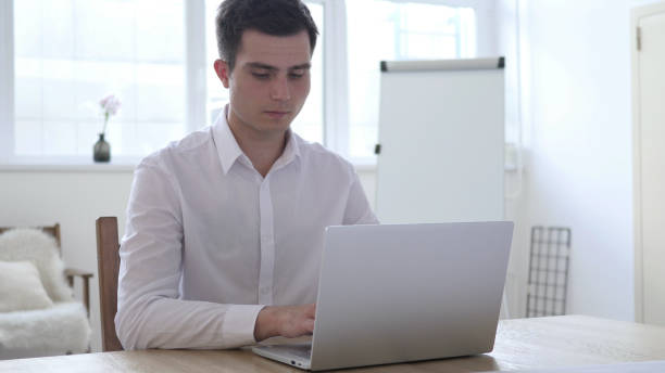 istock Headache, Stressed Businessman Working on Laptop 1039472590