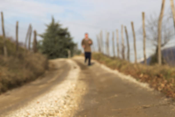 istock Defocused Runner on Country Road 1039481578