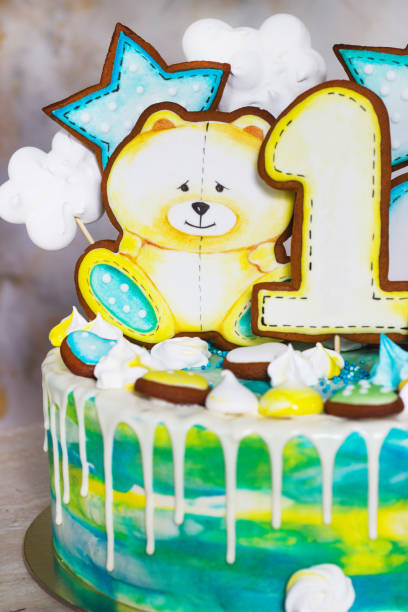 istock Modern bright children's cake with gingerbread cookies for one year 1039486608