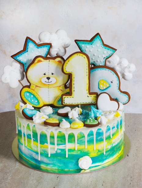 istock Modern bright children's cake with gingerbread cookies for one year 1039486652