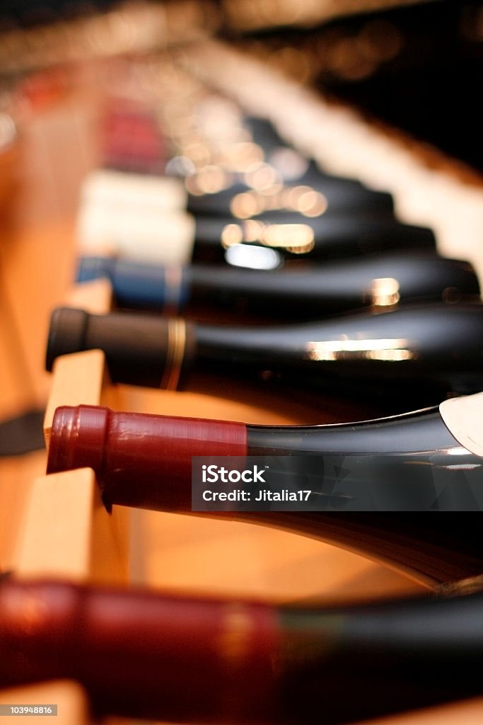 Red Wines on Wine Rack - Shallow Focus  Liquor Store Stock Photo