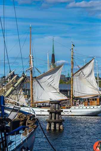 Stokhplm, Sweden, 06/08/2018, old sailing ships in the harbor, the building Vasa Museum, and Nordic Museum.